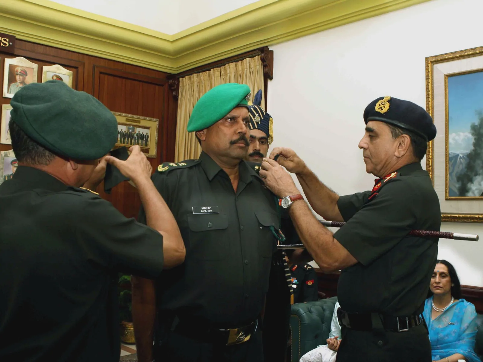 The Army Chief General Deepak Kapoor pinning the rank of Lieutenant Colonel on the shoulders of ace cricketer Kapil Dev as he voluntarily joined the Territorial Army during a ceremony in New Delhi on 